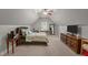 Cozy bedroom featuring vaulted ceilings, a comfortable bed, and ample natural light at 5916 Two Pines Trl, Wake Forest, NC 27587