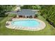View of the community pool featuring lounge chairs, umbrellas and a covered seating area at 5916 Two Pines Trl, Wake Forest, NC 27587