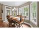 Sun-filled dining area featuring modern pendant lighting and seating for six at 5916 Two Pines Trl, Wake Forest, NC 27587