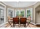 Dining room with natural light, a modern chandelier, and seating for six at 5916 Two Pines Trl, Wake Forest, NC 27587