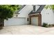Spacious three-car garage offering ample parking and storage, complemented by a well-kept driveway at 5916 Two Pines Trl, Wake Forest, NC 27587