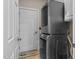 Laundry room featuring a stacked washer and dryer set, and a door with a cute welcome mat at 5916 Two Pines Trl, Wake Forest, NC 27587