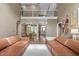 Spacious living room with fireplace, an overlook, and an adjacent dining area, complemented by hardwood floors at 5916 Two Pines Trl, Wake Forest, NC 27587