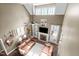 Bright living room with vaulted ceilings, a ceiling fan, a fireplace, and large windows offering plenty of natural light at 5916 Two Pines Trl, Wake Forest, NC 27587