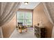Quiet sitting area with a comfortable chair, decorative accents, and natural light, perfect for relaxation and reading at 5916 Two Pines Trl, Wake Forest, NC 27587