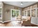 Bright sunroom showcasing modern furniture and access to the outdoor deck at 5916 Two Pines Trl, Wake Forest, NC 27587