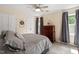 Comfortable bedroom showcasing a queen bed, soft carpeting, and a chest of drawers, offering a relaxing retreat at 669 Tyler Run Dr, Wake Forest, NC 27587