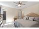 Inviting bedroom with a queen bed, stylish headboard, soft lighting, and ensuite bath access for added privacy at 669 Tyler Run Dr, Wake Forest, NC 27587