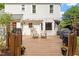 Inviting wooden deck with outdoor seating, perfect for relaxing and entertaining with string lights overhead at 669 Tyler Run Dr, Wake Forest, NC 27587