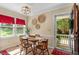 Bright dining area with decorative wall art and a view to the front porch at 669 Tyler Run Dr, Wake Forest, NC 27587