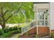 Quaint home featuring a brick staircase and a lush, landscaped front yard at 669 Tyler Run Dr, Wake Forest, NC 27587