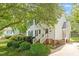 Charming home featuring a landscaped front yard and inviting entry at 669 Tyler Run Dr, Wake Forest, NC 27587