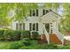 Charming home featuring a welcoming entrance with well-maintained landscaping at 669 Tyler Run Dr, Wake Forest, NC 27587