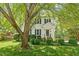 Well-manicured lawn and mature trees frame this lovely home at 669 Tyler Run Dr, Wake Forest, NC 27587