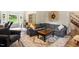 Comfortable living room showcasing stylish furniture, wood floors, and lots of natural light at 669 Tyler Run Dr, Wake Forest, NC 27587