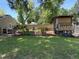 Backyard featuring well-manicured lawn, vegetable garden and chicken coop at 704 S Mineral Springs Rd, Durham, NC 27703