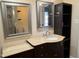 Bathroom vanity with elegant marble countertop, custom mirror and storage shelves at 704 S Mineral Springs Rd, Durham, NC 27703