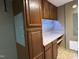 Convenient laundry room with ample cabinet space and countertop for folding laundry at 704 S Mineral Springs Rd, Durham, NC 27703
