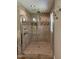 Beautiful tiled shower featuring multiple shower heads and seamless glass enclosure at 704 S Mineral Springs Rd, Durham, NC 27703
