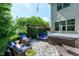 Relaxing outdoor space with a brick patio, seating area, hot tub, and lush greenery at 713 Liberty Cliff Dr, Cary, NC 27519