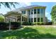 Expansive backyard showcasing a beautiful home with a screened-in porch and manicured landscaping at 713 Liberty Cliff Dr, Cary, NC 27519