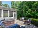 Cozy backyard featuring a hot tub, patio, fire pit, outdoor seating, and string lights at 713 Liberty Cliff Dr, Cary, NC 27519