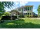 Stunning backyard view of a home with large windows and a screened-in porch perfect for outdoor living at 713 Liberty Cliff Dr, Cary, NC 27519