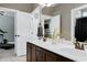 Bathroom featuring double sinks and granite countertop, dark wood cabinets at 713 Liberty Cliff Dr, Cary, NC 27519