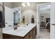 Bathroom featuring double sinks and granite countertop, dark wood cabinets at 713 Liberty Cliff Dr, Cary, NC 27519
