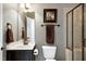 Bathroom with a tile shower, vanity, and neutral paint at 713 Liberty Cliff Dr, Cary, NC 27519