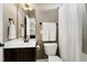 Bathroom featuring dark wood cabinets, a white sink, and a shower with a white shower curtain at 713 Liberty Cliff Dr, Cary, NC 27519