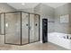 Modern bathroom showcasing a glass-enclosed shower, soaking tub, dark cabinets and granite countertops at 713 Liberty Cliff Dr, Cary, NC 27519