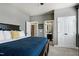Comfortable bedroom with doors to the bathroom and closets providing ample storage space at 713 Liberty Cliff Dr, Cary, NC 27519