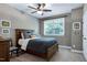 Cozy bedroom with a window providing natural light, complemented by a plush bed and a classic wooden dresser at 713 Liberty Cliff Dr, Cary, NC 27519