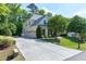 Charming home with a three-car garage, basketball hoop, and well-manicured lawn at 713 Liberty Cliff Dr, Cary, NC 27519