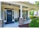 Cozy front porch with decorative columns, seating, and a welcoming entrance at 713 Liberty Cliff Dr, Cary, NC 27519