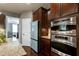 Gourmet kitchen with stainless steel appliances, granite countertops, and ample cabinet space at 713 Liberty Cliff Dr, Cary, NC 27519