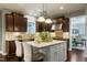 Kitchen features an island with seating, stainless steel appliances, and ample counter space at 713 Liberty Cliff Dr, Cary, NC 27519