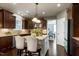 A well-appointed kitchen features an island with seating and pendant lights, plus modern appliances at 713 Liberty Cliff Dr, Cary, NC 27519