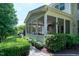 Inviting screened-in porch, perfect for relaxing and entertaining with beautiful brick landscaping at 713 Liberty Cliff Dr, Cary, NC 27519