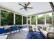 Inviting sunroom with comfortable seating and large windows providing natural light and backyard views at 713 Liberty Cliff Dr, Cary, NC 27519