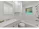 This is a bright bathroom with a white sink, toilet and shower/bath combo at 725-727 Locust Ln, Raleigh, NC 27603