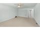 Spacious bedroom with a ceiling fan and light neutral decor at 725-727 Locust Ln, Raleigh, NC 27603