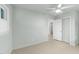 Spacious bedroom featuring a ceiling fan, natural light, and an open closet at 725-727 Locust Ln, Raleigh, NC 27603