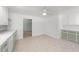 A bright kitchen with light-green cabinets and vinyl flooring at 725-727 Locust Ln, Raleigh, NC 27603
