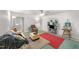 Cozy living room with neutral walls, ceiling fan, eclectic furnishings, and natural lighting at 725-727 Locust Ln, Raleigh, NC 27603