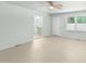 Open-concept living room with access to the kitchen and ample natural light at 725-727 Locust Ln, Raleigh, NC 27603