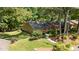 Aerial view of home with tree lined property at 7918 Yester Ct, Raleigh, NC 27615