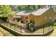 Exterior view of the home with a fenced backyard and patio area, offering privacy and space for outdoor activities at 7918 Yester Ct, Raleigh, NC 27615