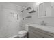 Beautiful bathroom with a tiled shower, floating shelves, modern vanity and mosaic floors at 7918 Yester Ct, Raleigh, NC 27615